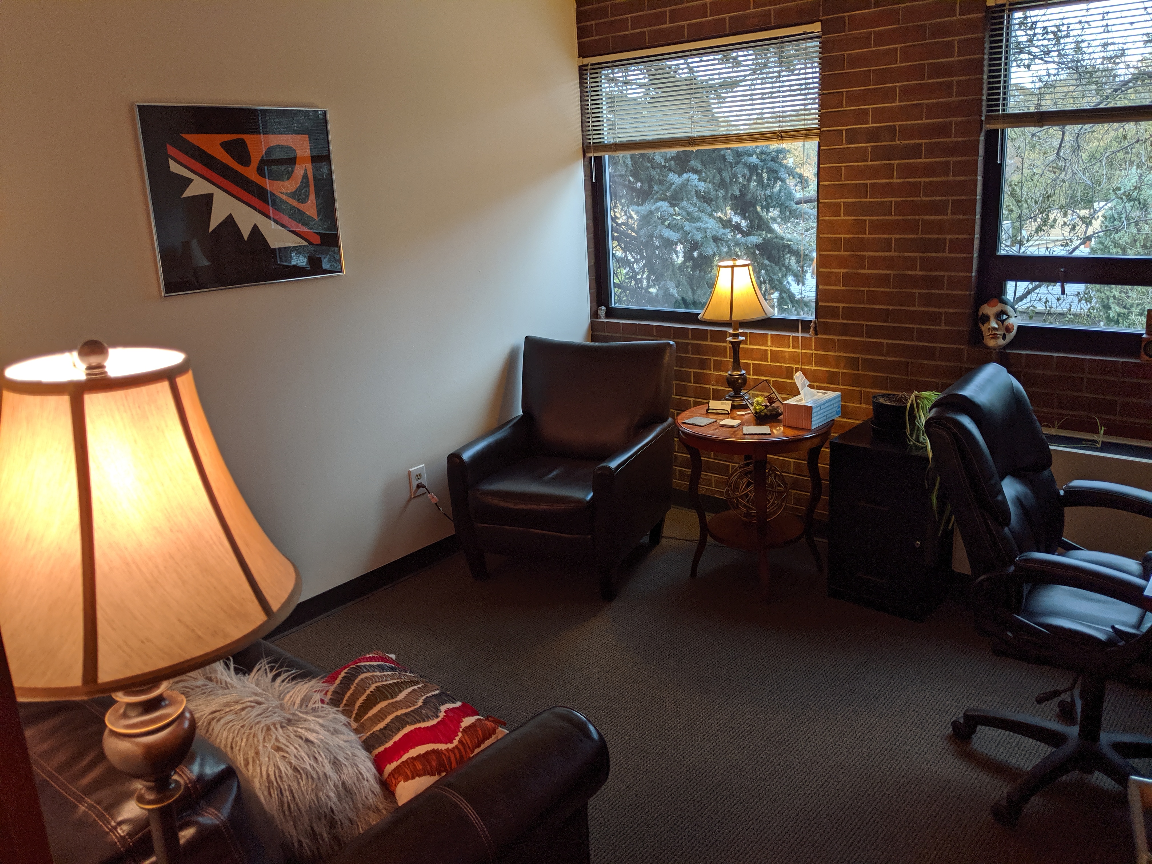 Lots of Natural lighting warmed by lamps help make my office comfortable.